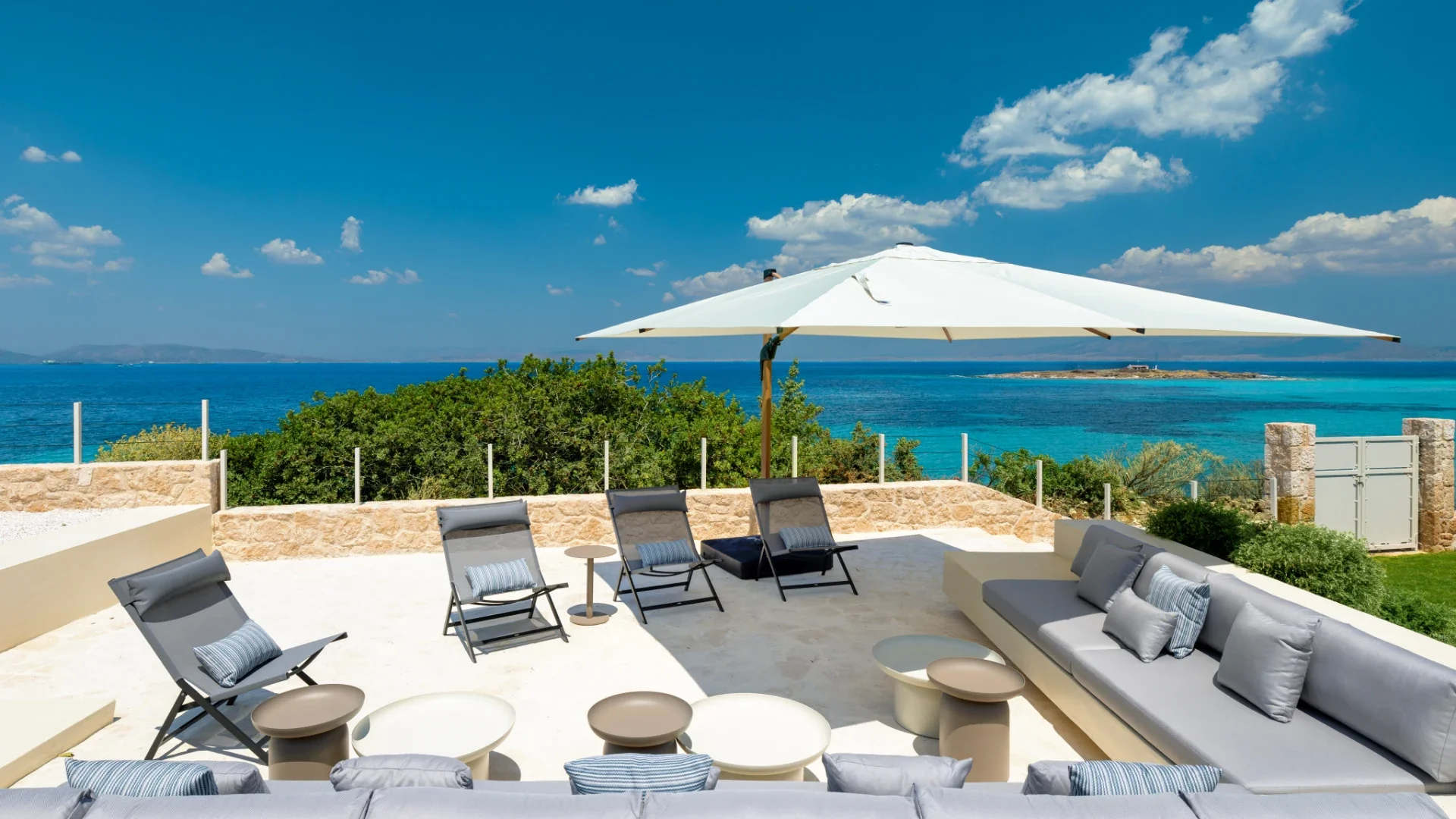 Kyrelia Villa and pool at sunset beside the sea